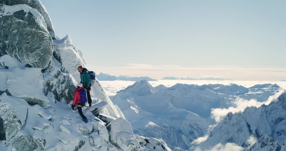 Two climbers are on a very high snow mountain