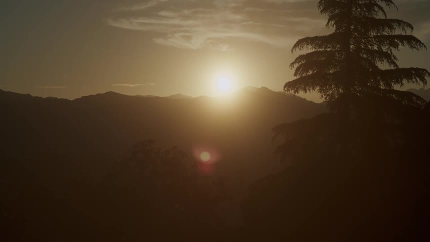 Sun sets over the mountains