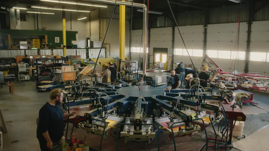 The workers are operating the machines in the factory