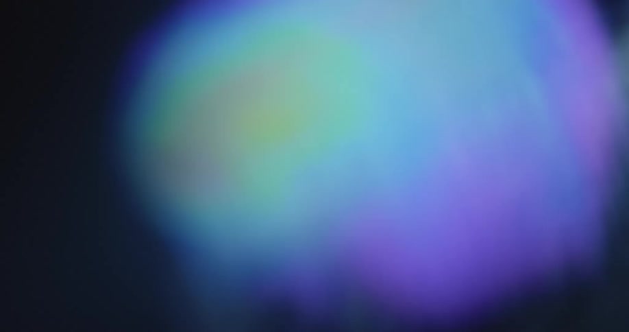Extreme macro closeup with dynamic camera movement of a digital TV or computer screen displaying a weather radar with circular moving temperature waves or wind prediction during the weather forecast