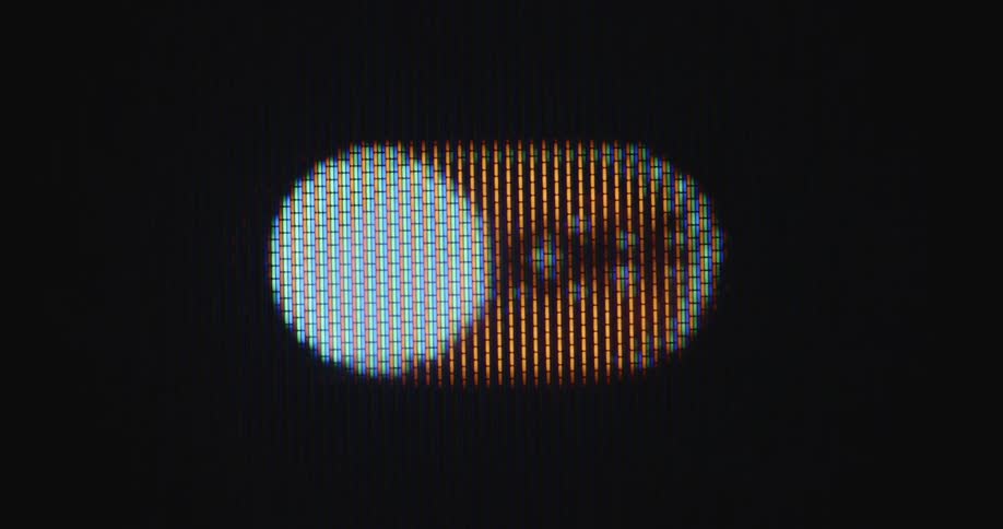 First person view perspective of a human finger clicking a power button on a pixelated screen that switches between a red off sign and a green on setting