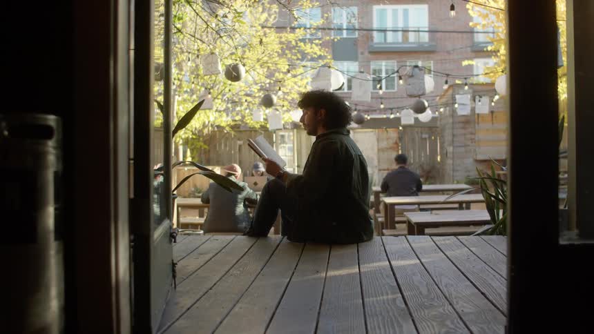 Man sitting and reading a book
