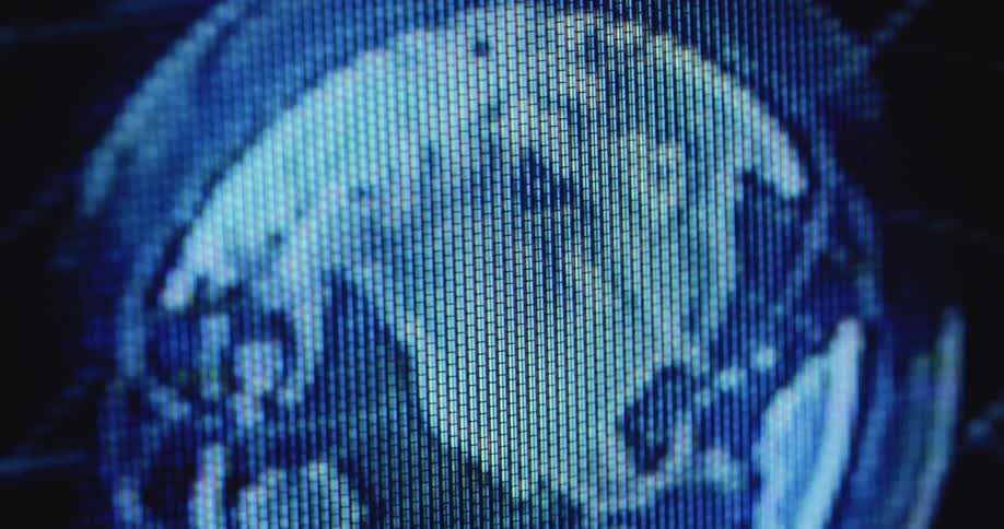 Digital representation of planet earth as an animated transparent globe seen from space on a black and blue television screen with special pixelated effect and transformation