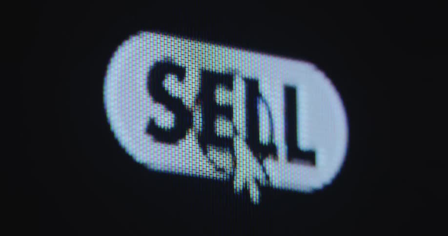 The user of an online platform or computer program is clicking onto a sell button on a display or PC screen while trading stocks on a digital stock exchange or finance application