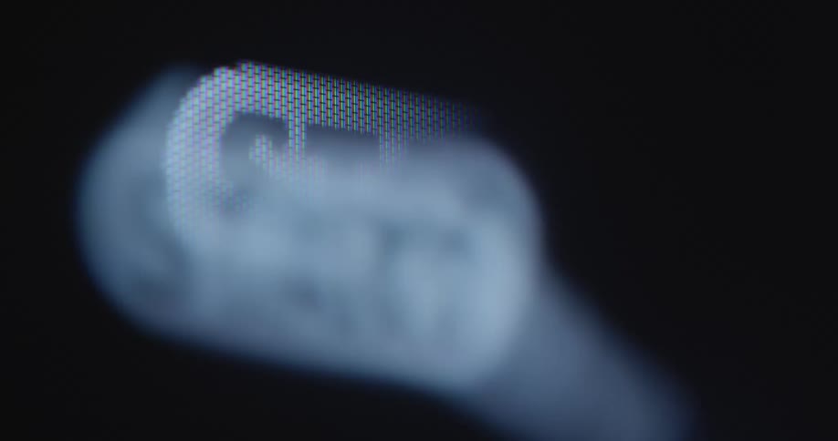 Extreme macro close up of computer screen displaying a mouse cursor clicking on or pressing a start button to begin a program or an upload or download from the internet or an online platform