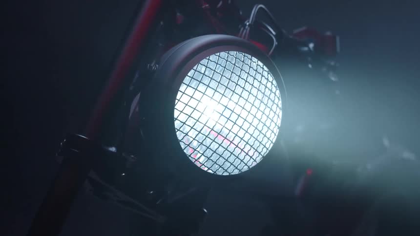 The headlight on the motorcycle is bright