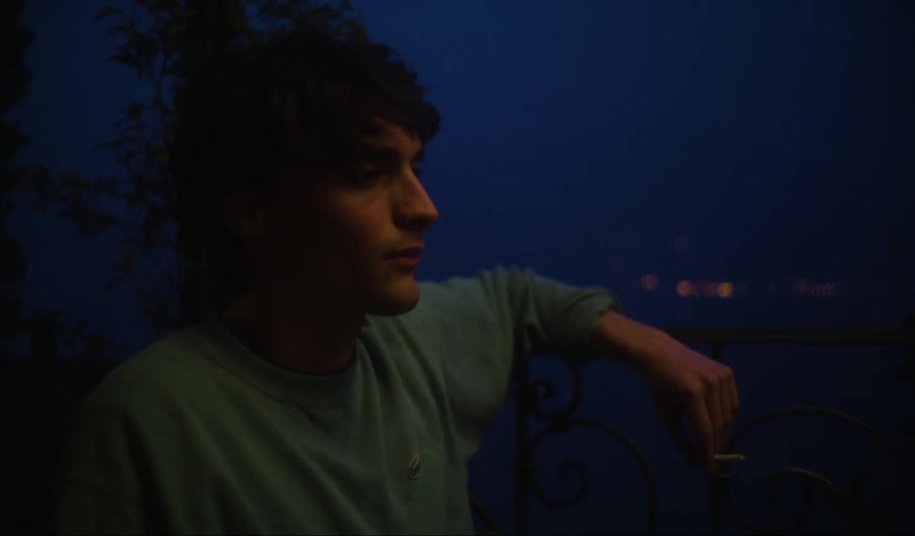 A man is smoking outside