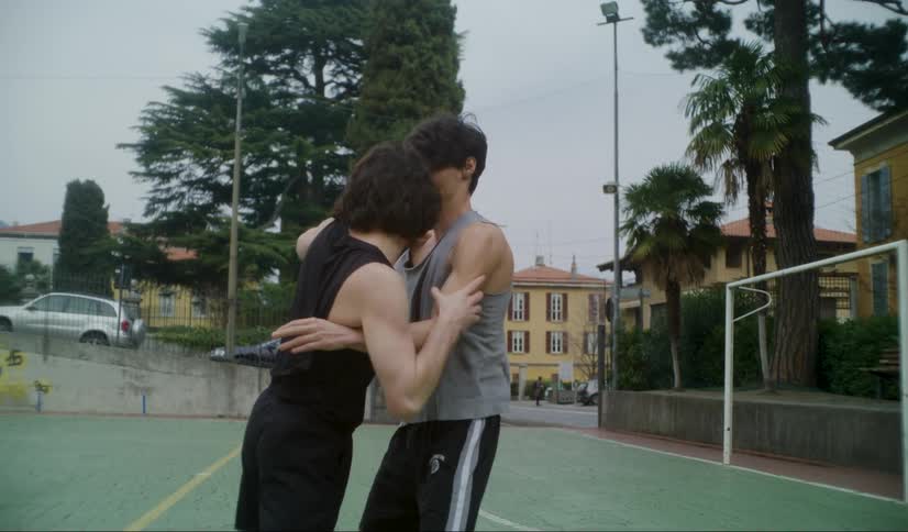 Two men are fighting outside