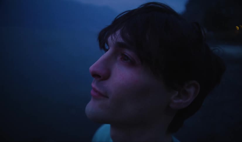 A young man is happy while looking up