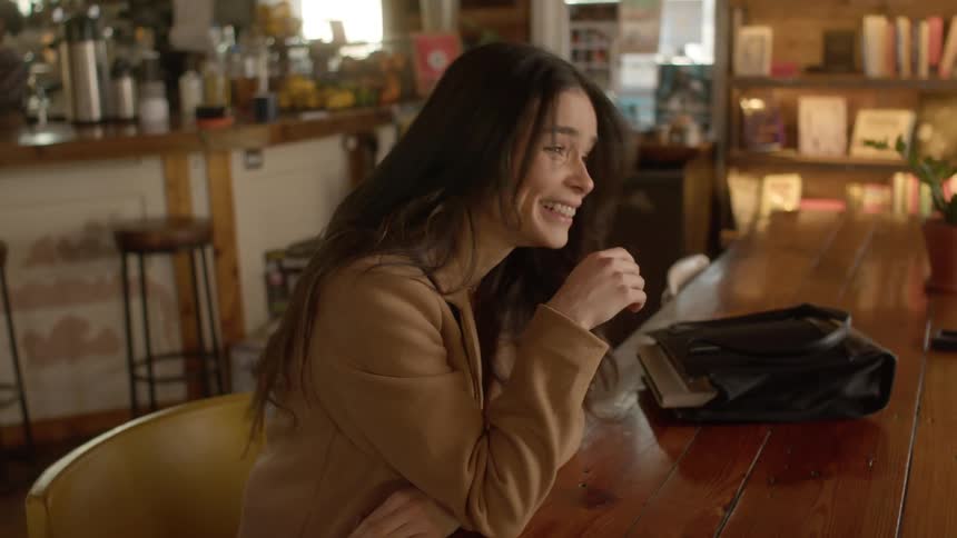 Two friends have fun talking in the coffee shop