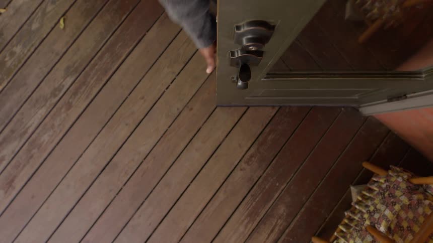 Customer opens the door to enter a store