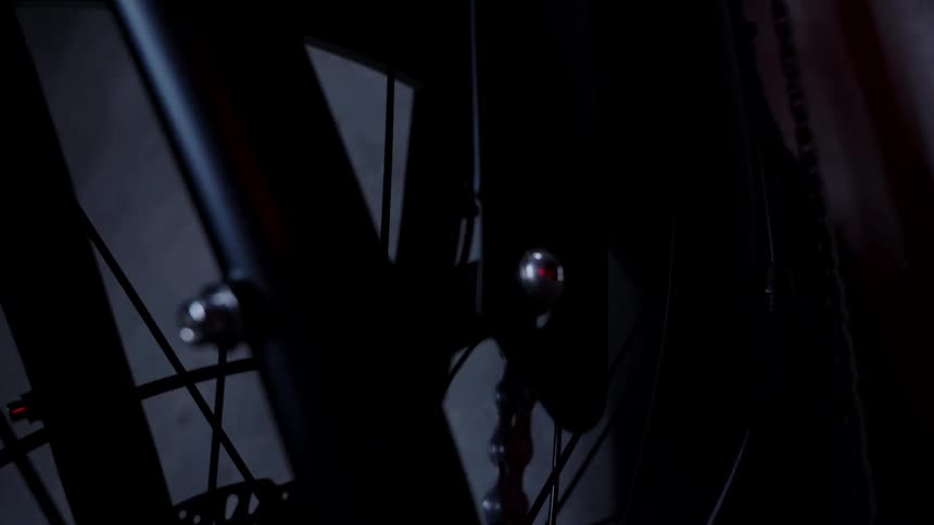 Zooming in and around a single bicycle to focus on the spokes