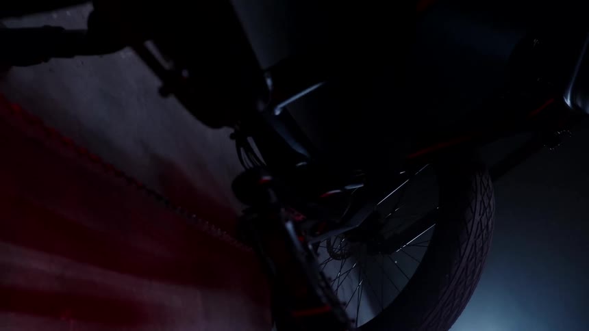Bicycle wheel tire spokes and pedal backlit indoors
