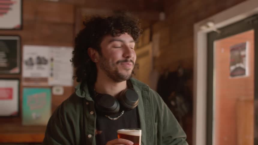 Customer buying a beer at a bar