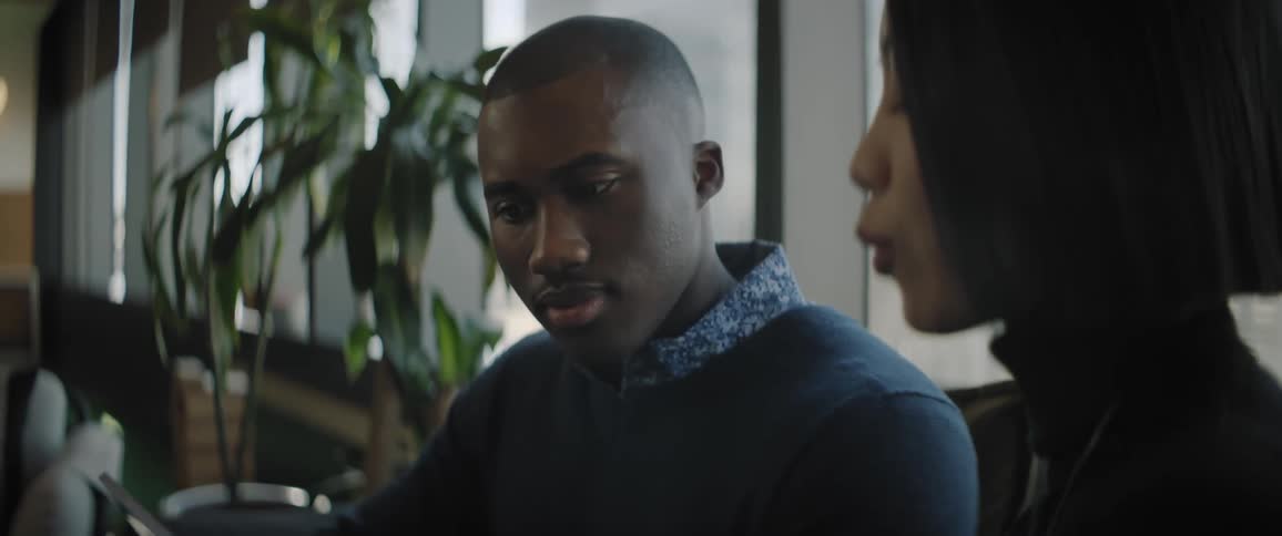 A man and a woman in a business meeting in an office