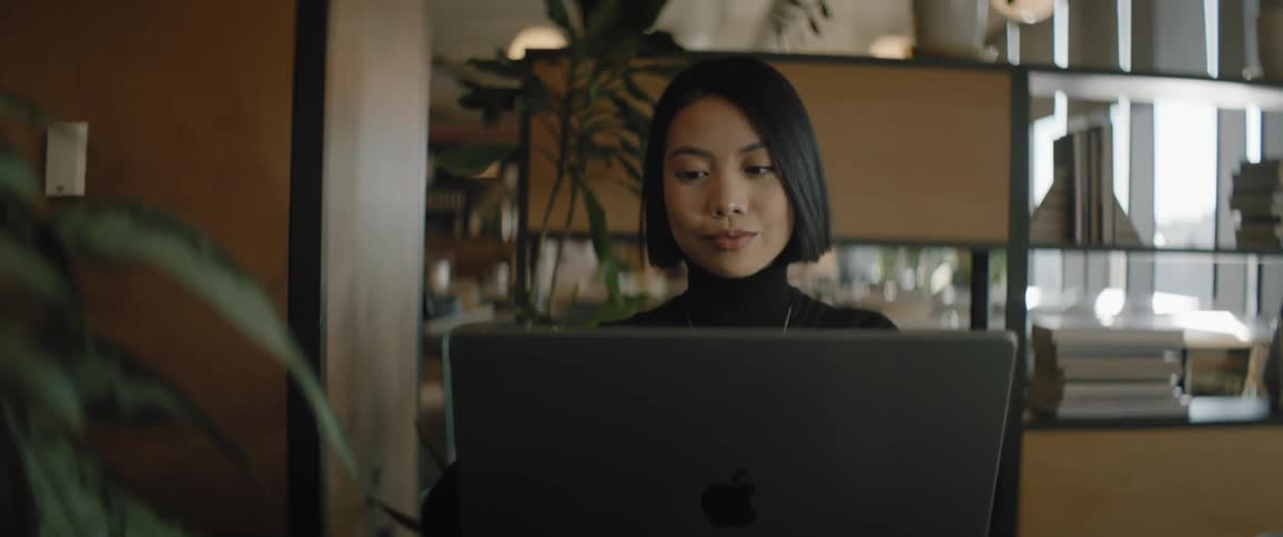 A young woman working on a computer in the office