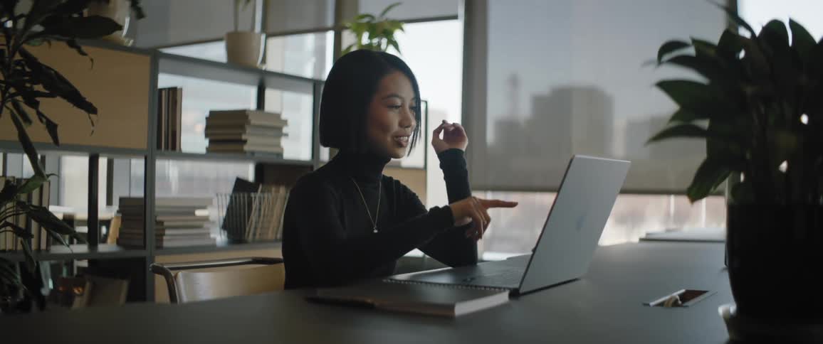 A clip of a lady working on her laptop in the office