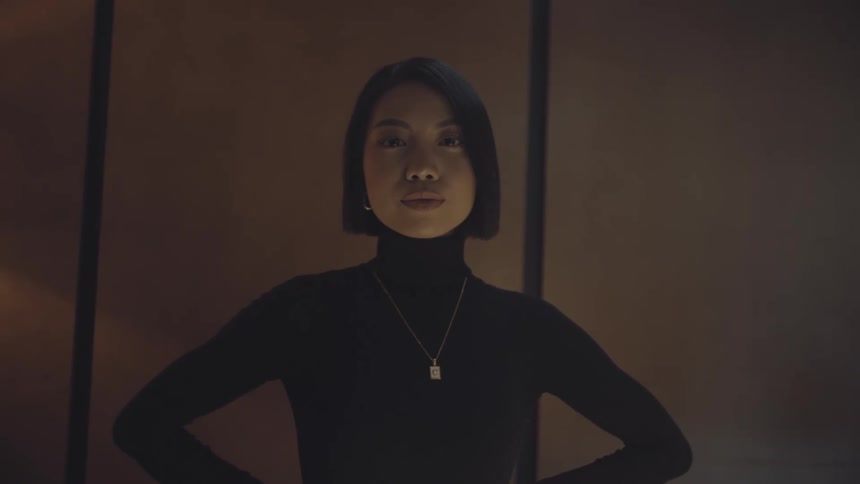 A young executive in an office at night
