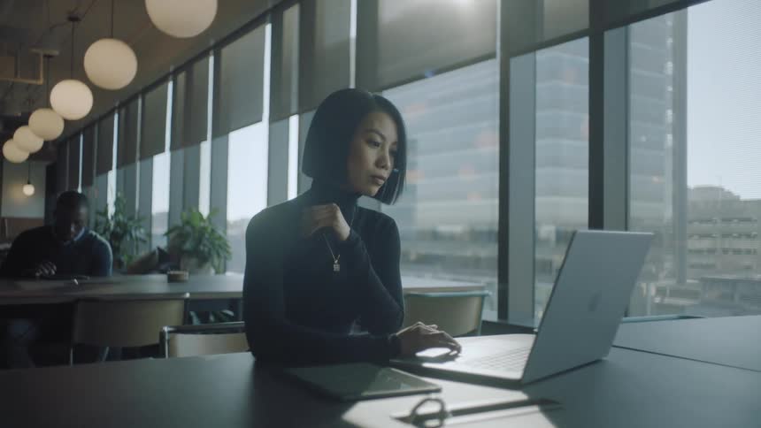 Executives in an office working on computers
