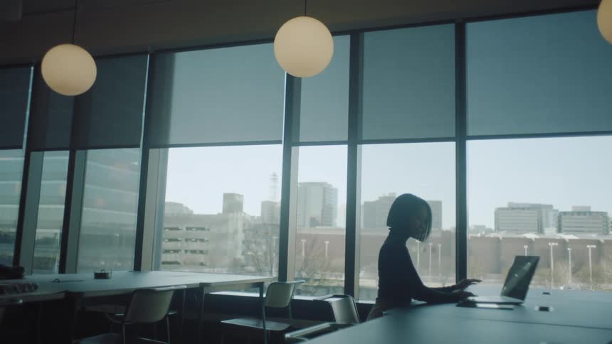 Woman working on a laptop at the office