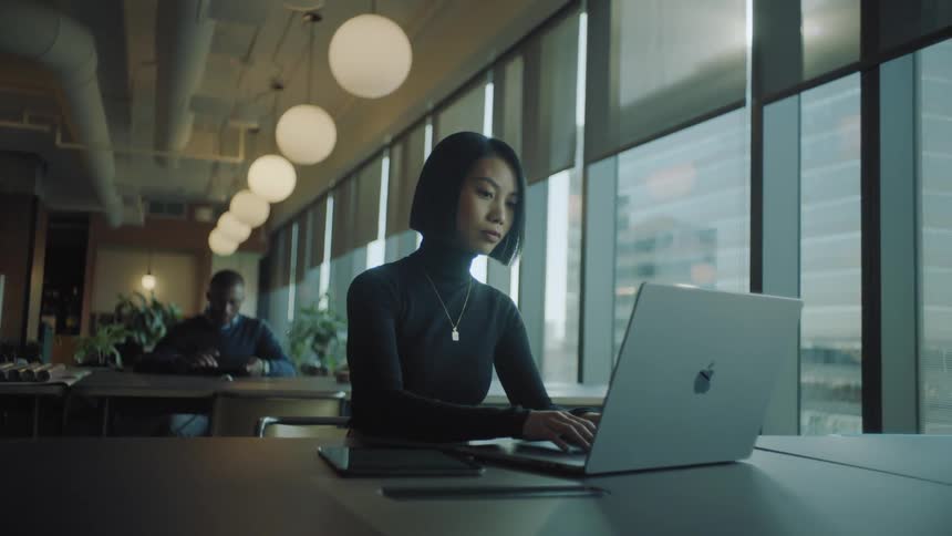 Executives working on their computers in an office