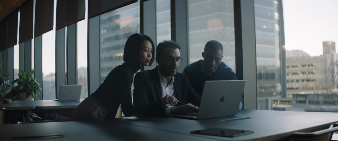Executives working on a computer in the office during the day