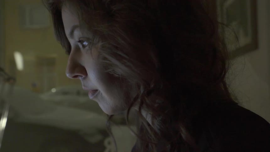 An ambitious freelancer manages her online business tasks from a quiet home office setting.