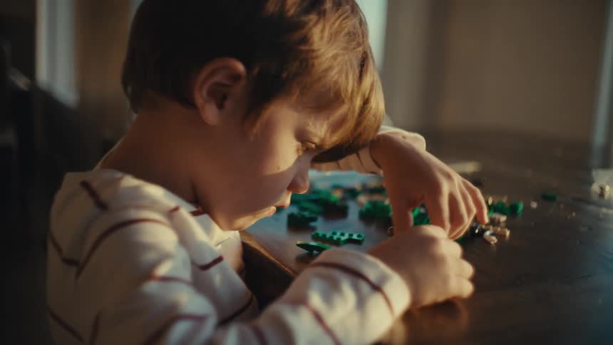 A child is playing with legos