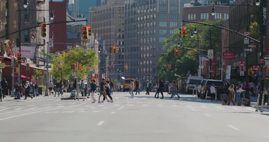 Pedestrians crossing the street on the city