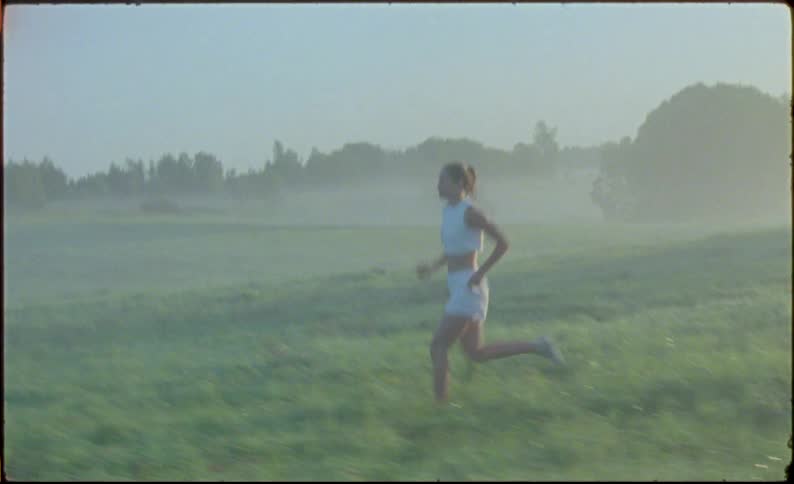 Young fit woman jogging on the countryside at morning