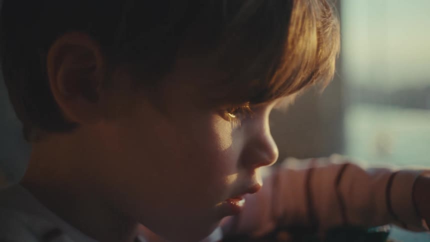 Boy playing alone with toys at home in the morning