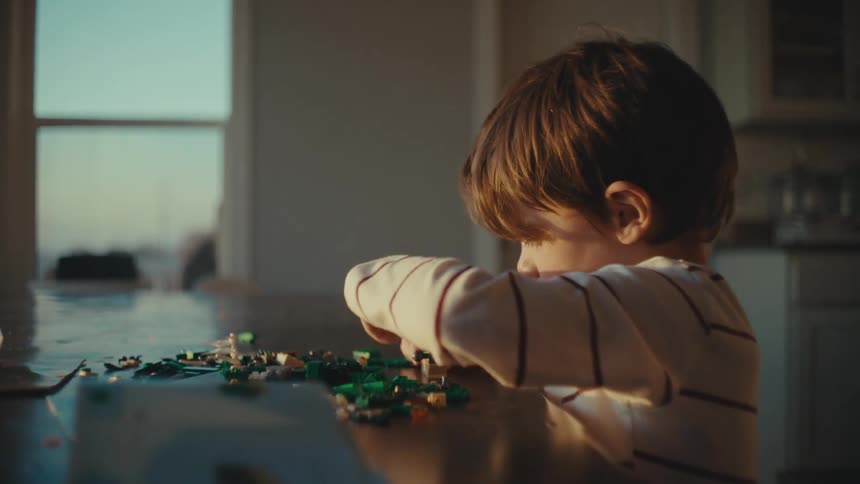 Boy playing alone at home in the morning