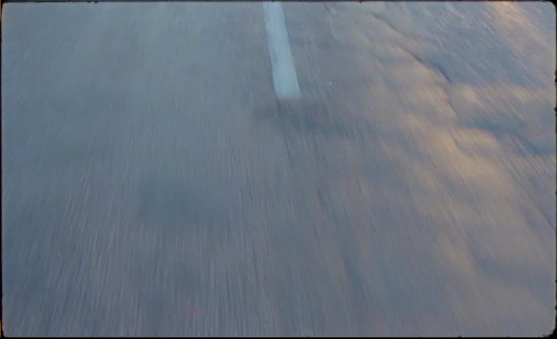 Lines on the road at morning caught on vintage film