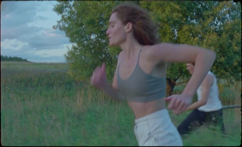 Friends running through the countryside