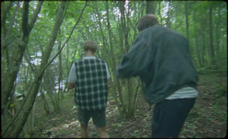 Group of friends walk in the forest