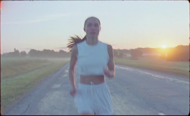 Young fit woman jogging on the countryside at morning