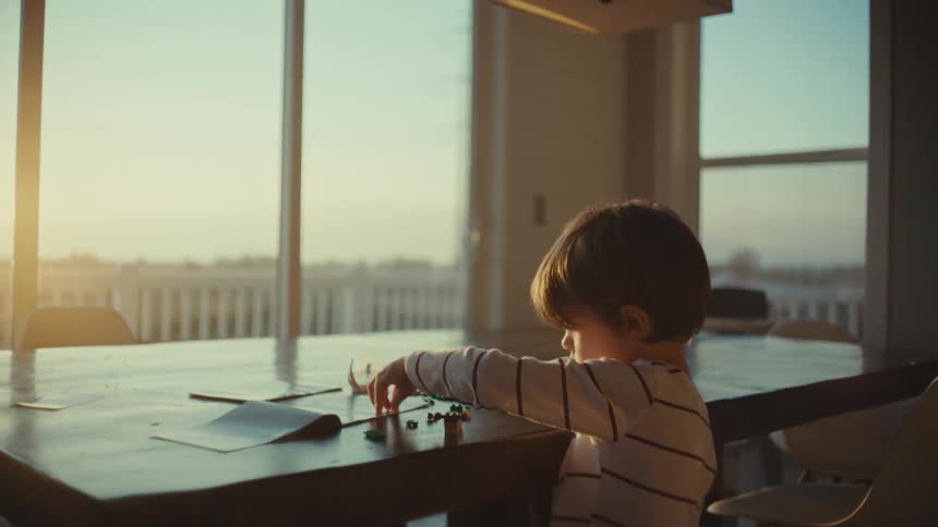 A child is playing with legos