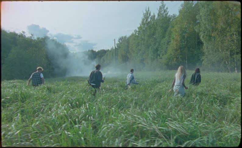 A group of friends hunting in an open field in the forest