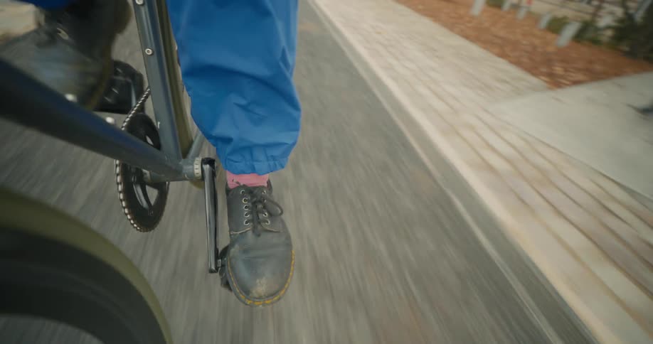 Close up of a cyclist pedaling a bicycle