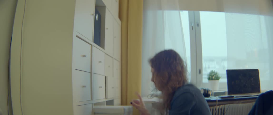 Woman looks through drawers and a purse searching for something