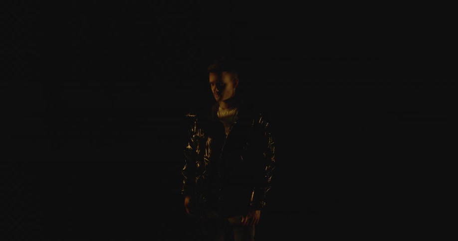 Young man modeling under moving shadows