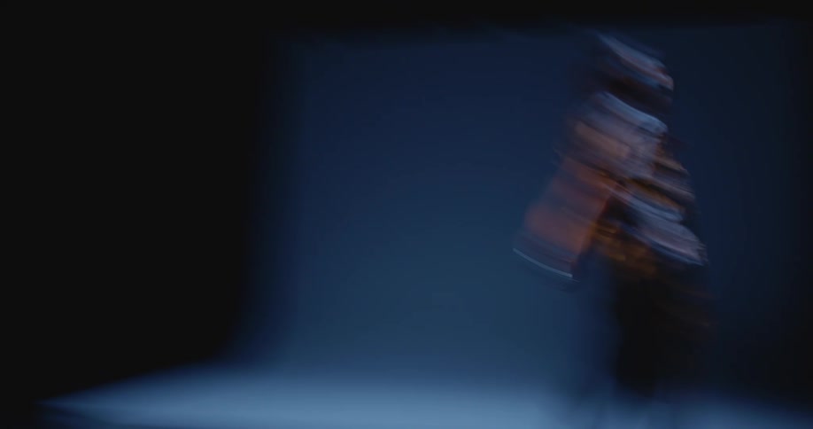 Chaotic shot of a woman modeling in a studio