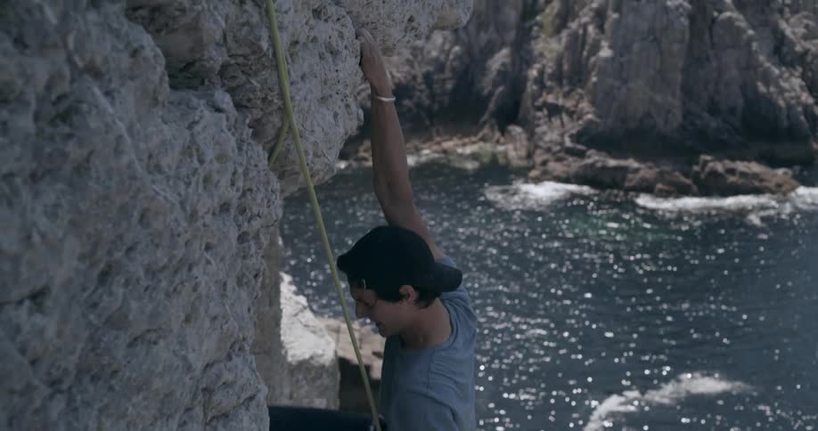 A man is rock climbing