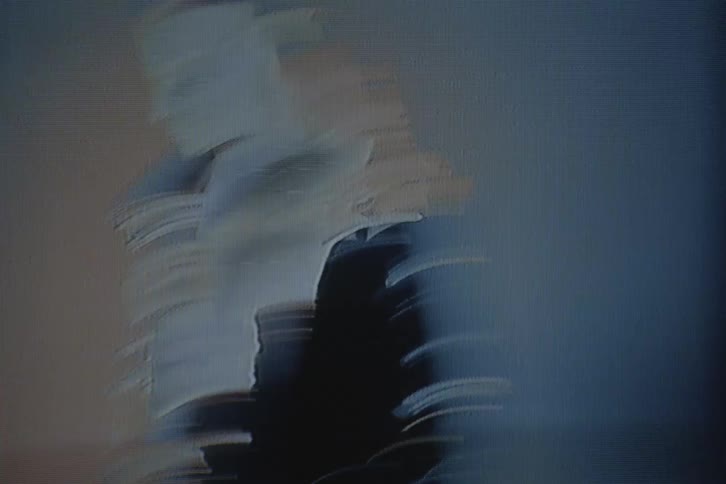 Chaotic shot of a man modeling in a studio