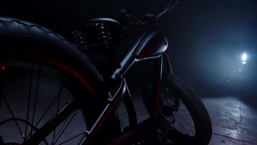 A motorized bicycle in a dark room