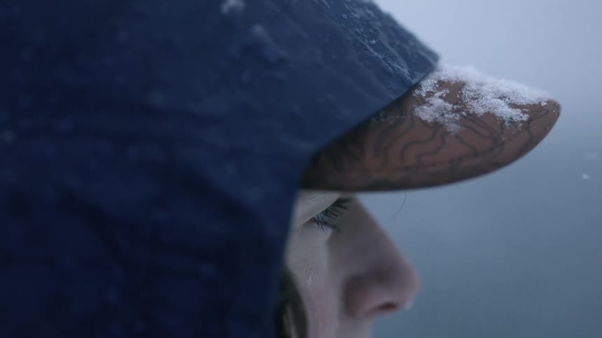 Snowflakes on the visor of a baseball cap