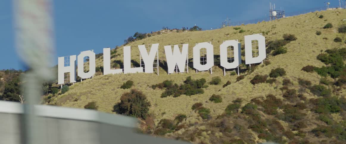 The hollywood sign is on the mountain