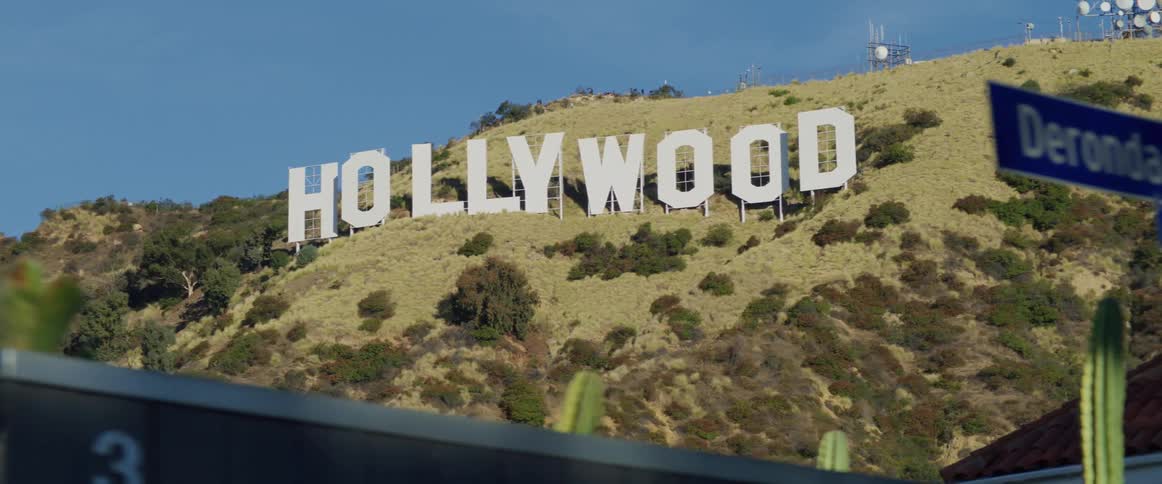 The hollywood sign is on the mountain