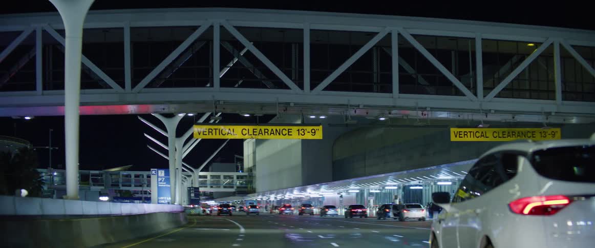 Expressway with smooth traffic in urban city airport at night