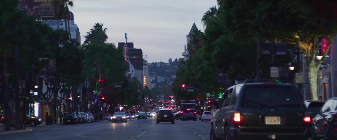 Cars driving on the streets of los angeles at evening
